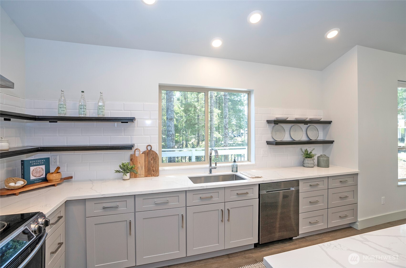 240 East Susan Lane Union, WA 98592 - Photo 14 of 40 a kitchen with a sink window and cabinets