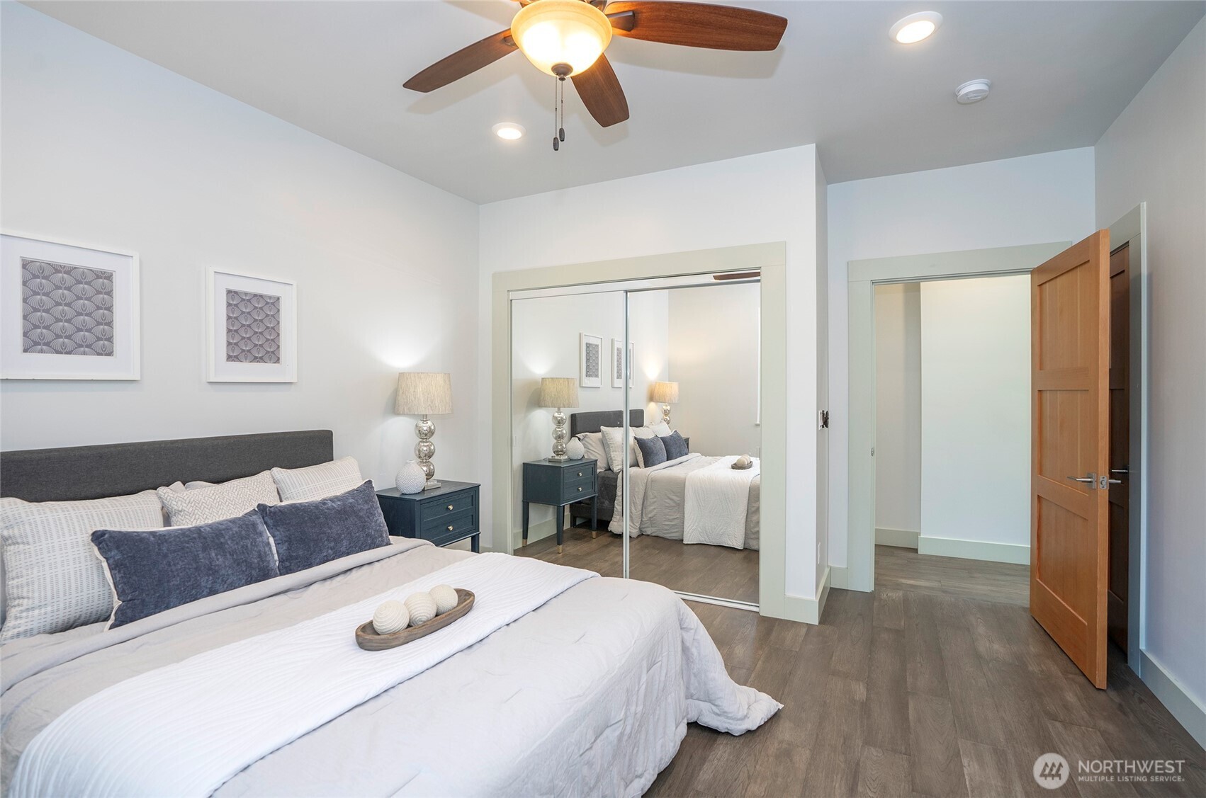 240 East Susan Lane Union, WA 98592 - Photo 18 of 40 a bedroom with a bed and a chandelier