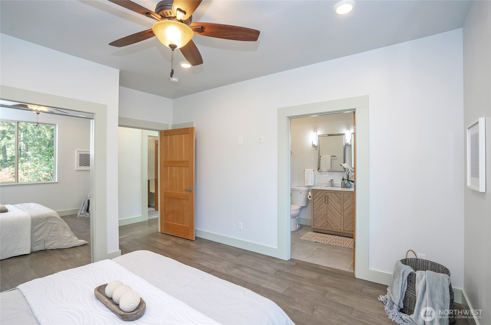 240 East Susan Lane Union, WA 98592 - Photo 19 of 40 a bedroom with a bed and a chandelier