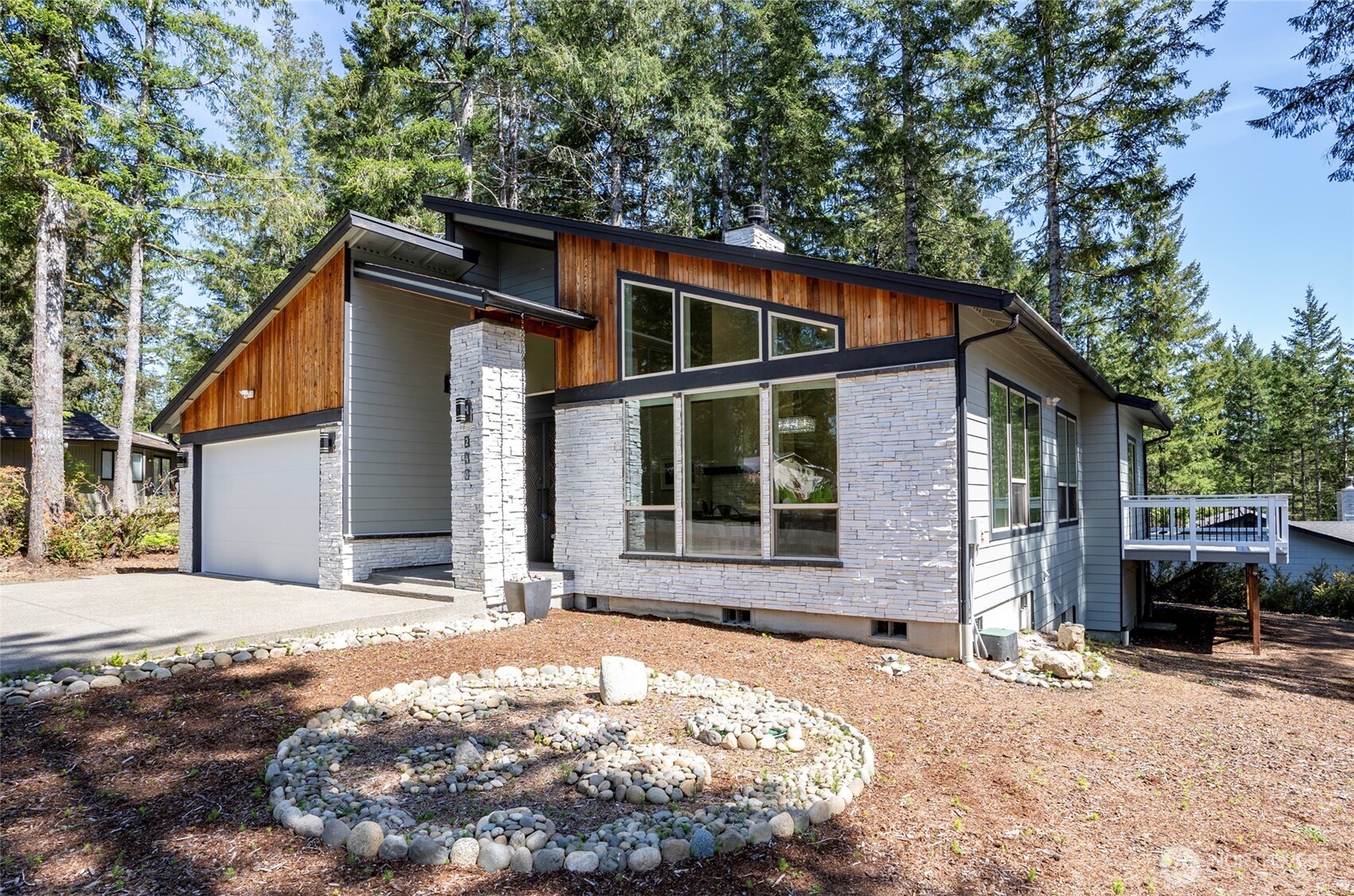 240 East Susan Lane Union, WA 98592 - Photo 2 of 40 a front view of a house with a yard and garage