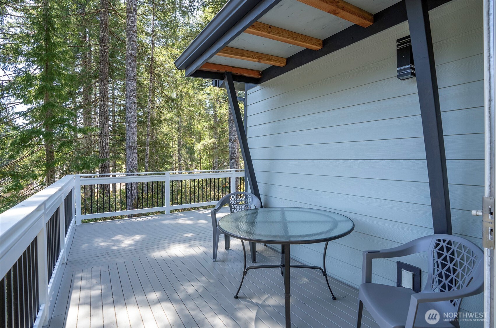 240 East Susan Lane Union, WA 98592 - Photo 31 of 40 a balcony with table and chairs