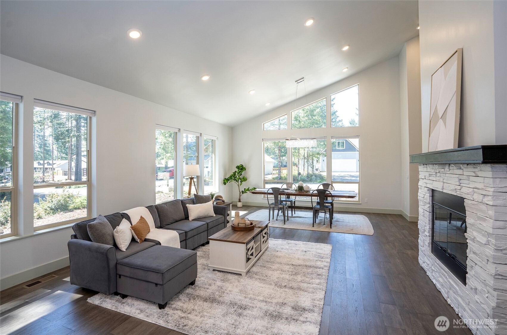 240 East Susan Lane Union, WA 98592 - Photo 9 of 40 a living room with fireplace furniture and a large window