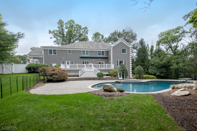 12 Oak Hill Road Bernards, NJ 07920 - Photo 28 of 33 a front view of a house with garden and swimming pool