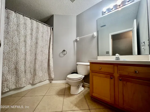 a view of a table and chairs under an umbrella