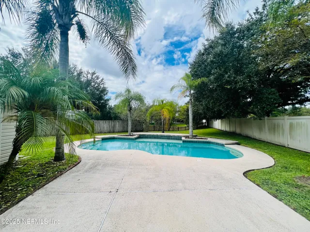 a sign that is sitting in front of flowers