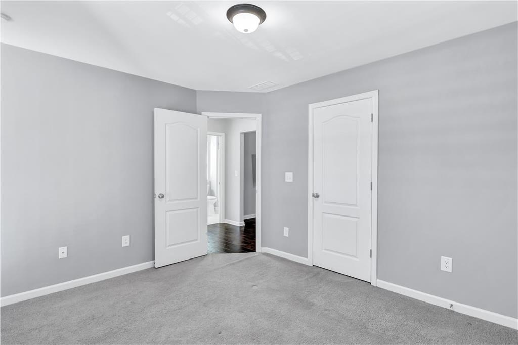 330 Avalon Square Fairburn, GA 30213 - Photo 33 of 52 an empty room with closet and windows