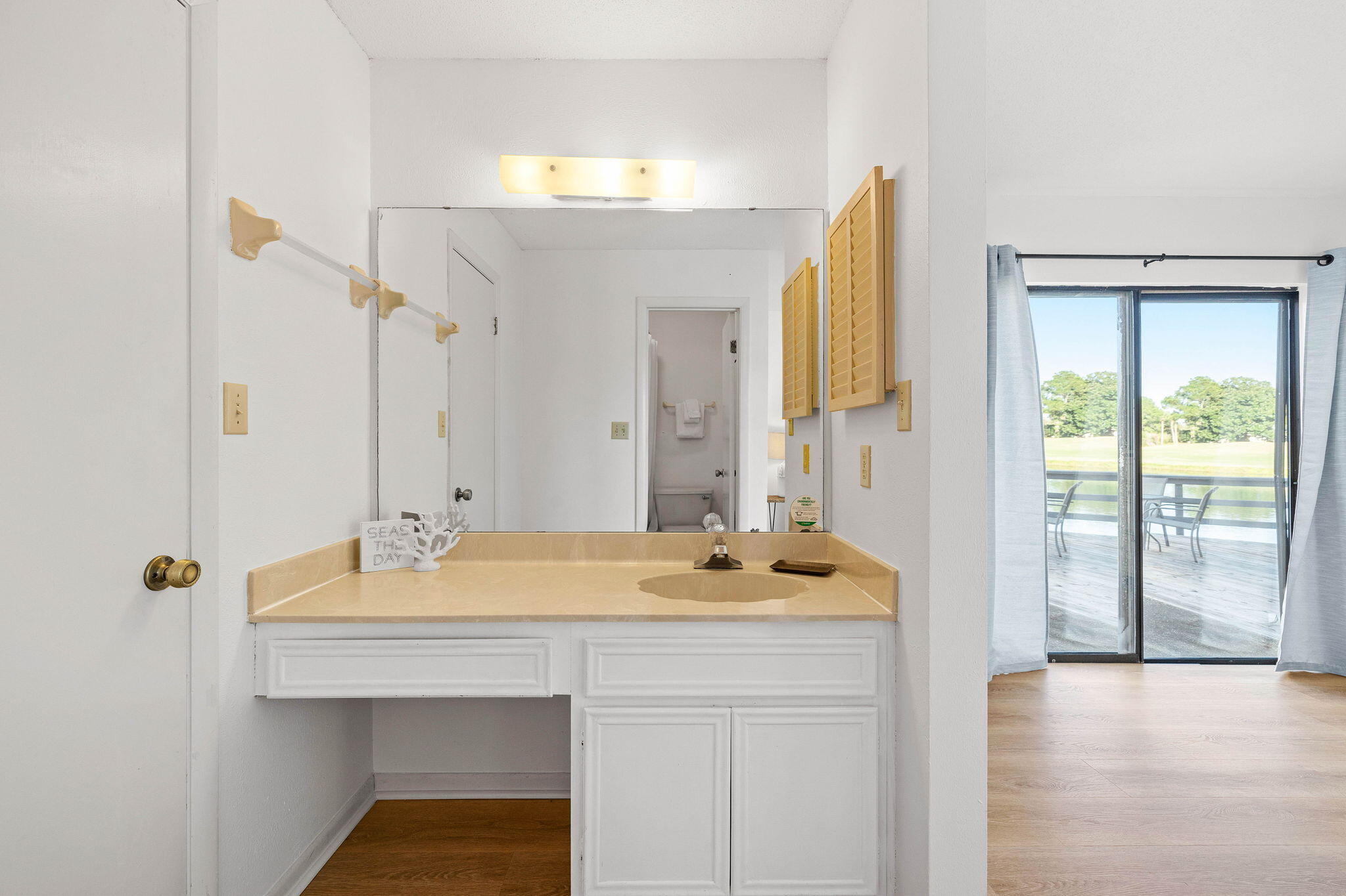 439 Linkside Circle Miramar Beach, FL 32550 - Photo 12 of 22 a bathroom with a sink and a mirror