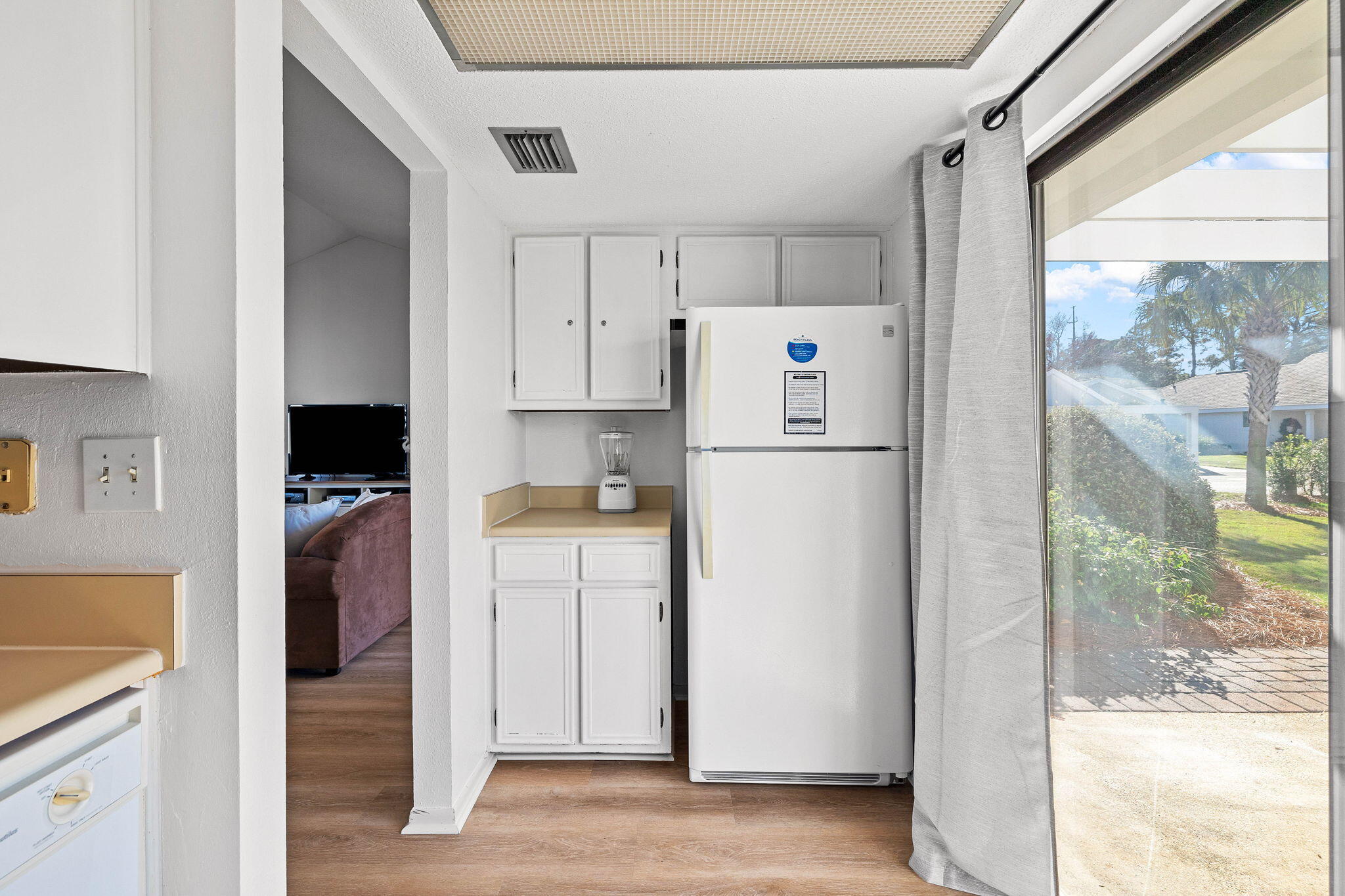 439 Linkside Circle Miramar Beach, FL 32550 - Photo 16 of 22 a kitchen with a refrigerator a stove and a window