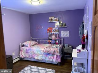 920 3rd Avenue Croydon, PA 19021 - Photo 7 of 12 a bed room with a bed and a painting on the wall