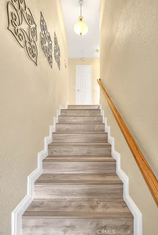 a view of a dinning table and chairs in patio of the house