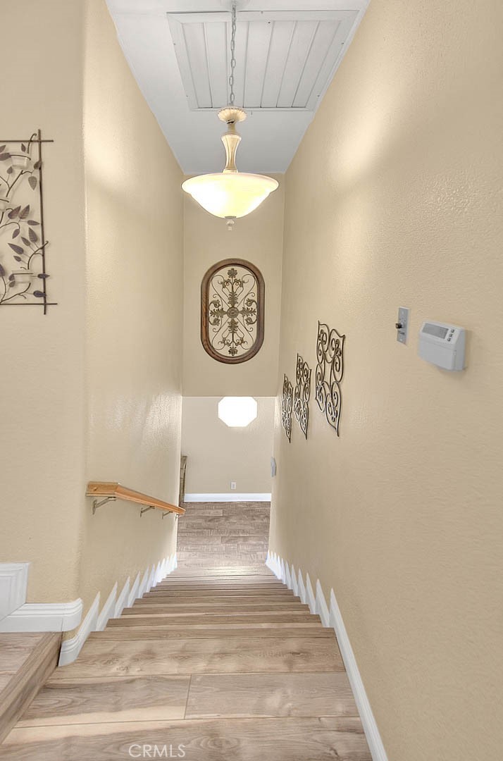 14452 Harvey Lane Riverside, CA 92503 - Photo 20 of 50 a view of a hallway with a fan