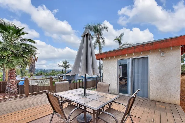 an aerial view of a house with garden space and street view