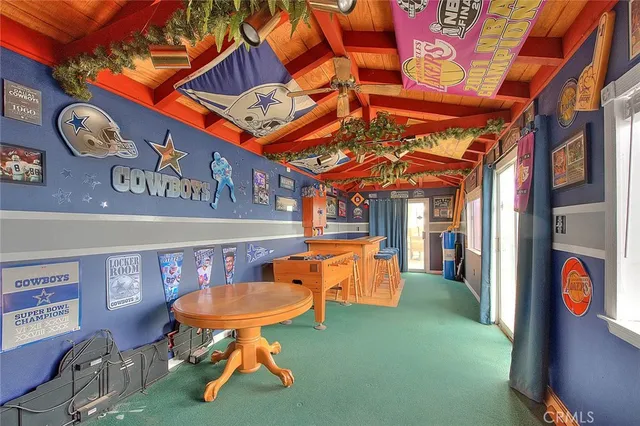 a view of a backyard with plants and a patio