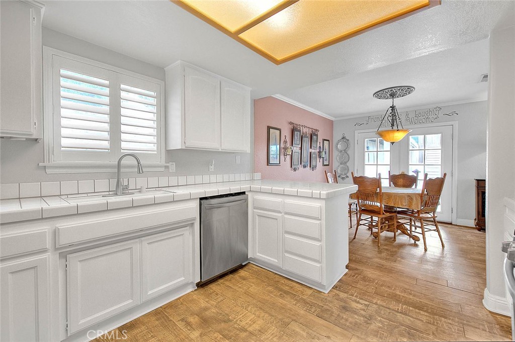 14452 Harvey Lane Riverside, CA 92503 - Photo 8 of 50 a kitchen with sink and cabinets