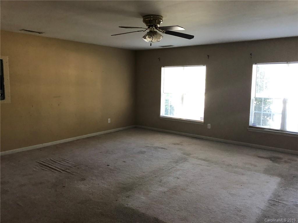 6319 Nevin Road Charlotte, NC 28262 - Photo 4 of 7 a view of an empty room with a window