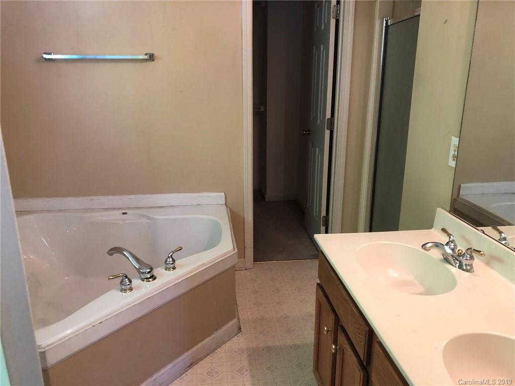 6319 Nevin Road Charlotte, NC 28262 - Photo 7 of 7 a bathroom with a sink and a bathtub