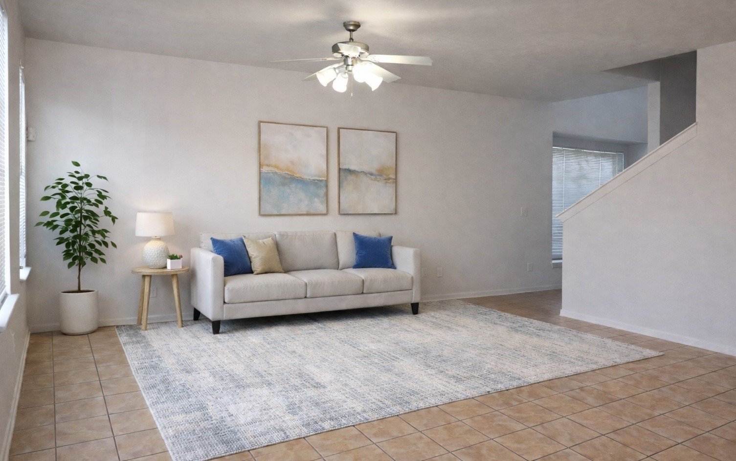 Spacious livingroom area with plenty of natural light. Virtually staged.