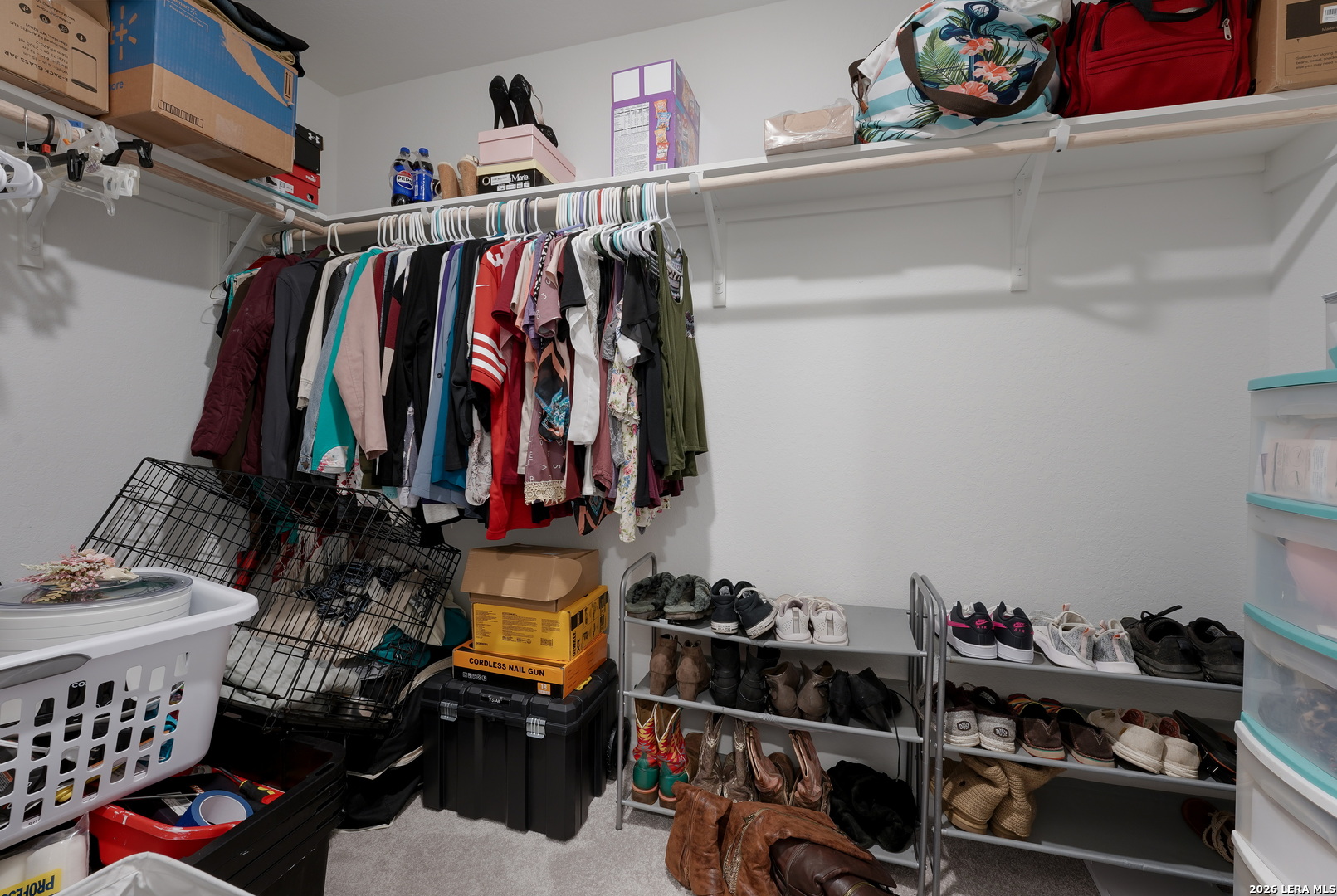 13012 Hancock Pool St. Hedwig, TX 78152 - Photo 19 of 32 a view of walk in closet with clothes and shoes