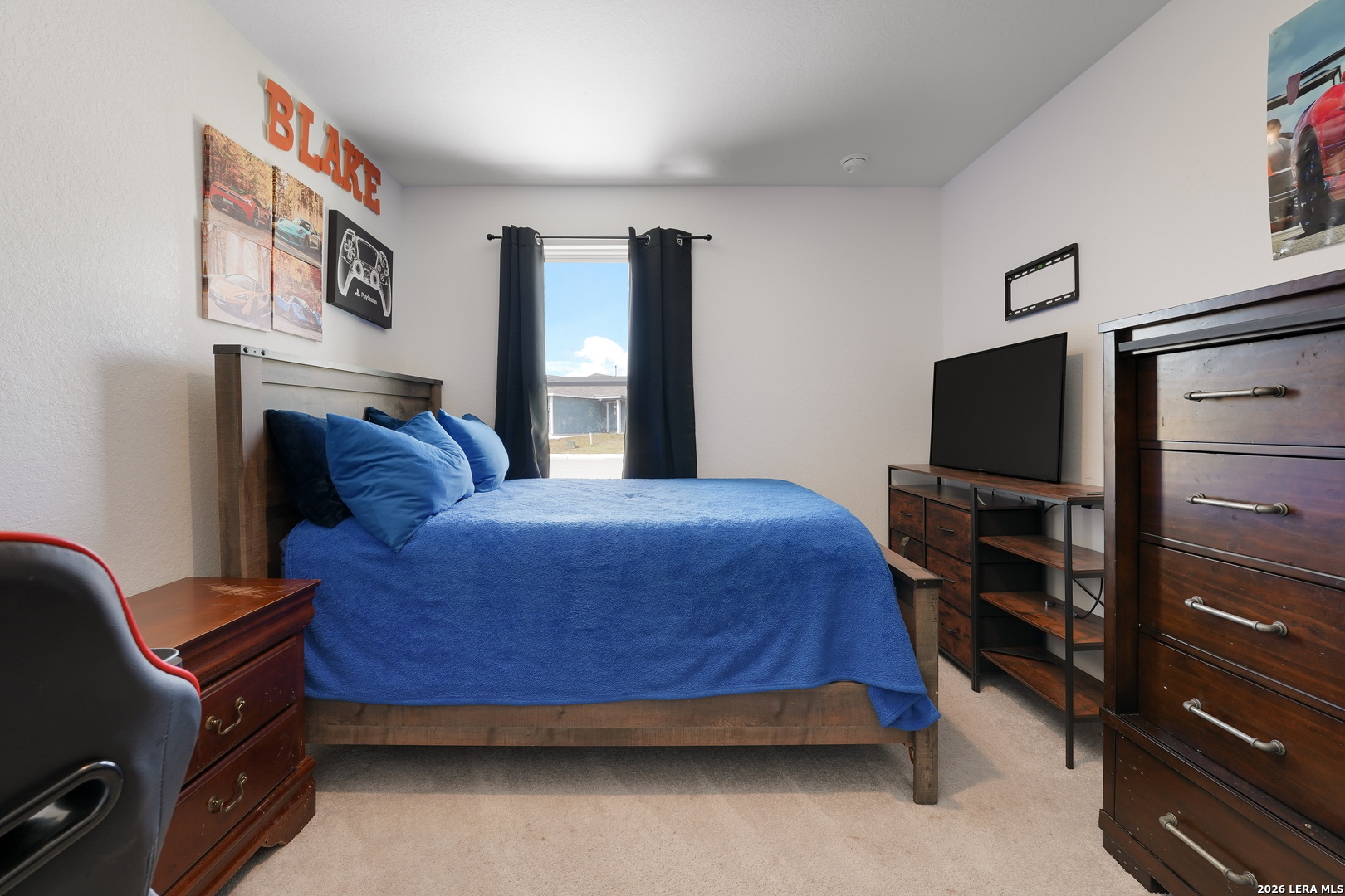 13012 Hancock Pool St. Hedwig, TX 78152 - Photo 26 of 32 a bedroom with a bed and a flat screen tv