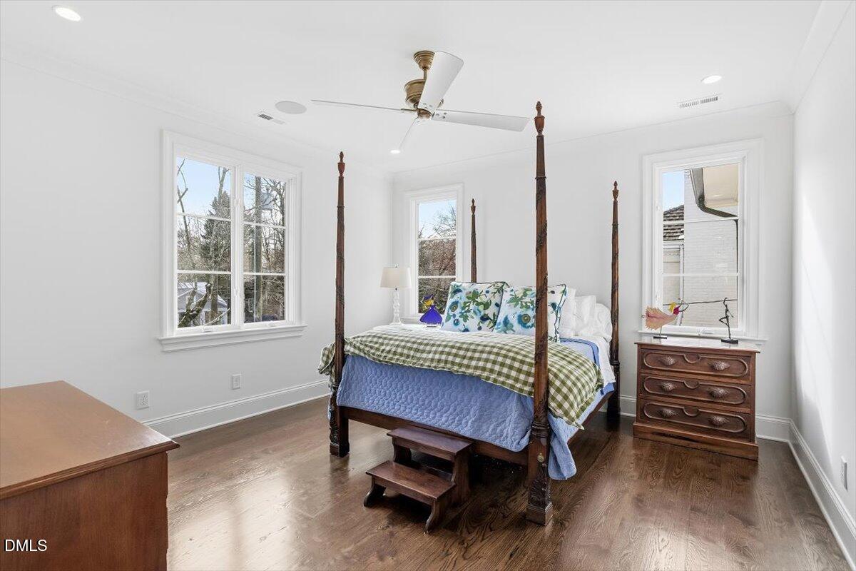 2123 St Marys Street Raleigh, NC 27608 - Photo 46 of 77 a living room with a bed furniture and windows