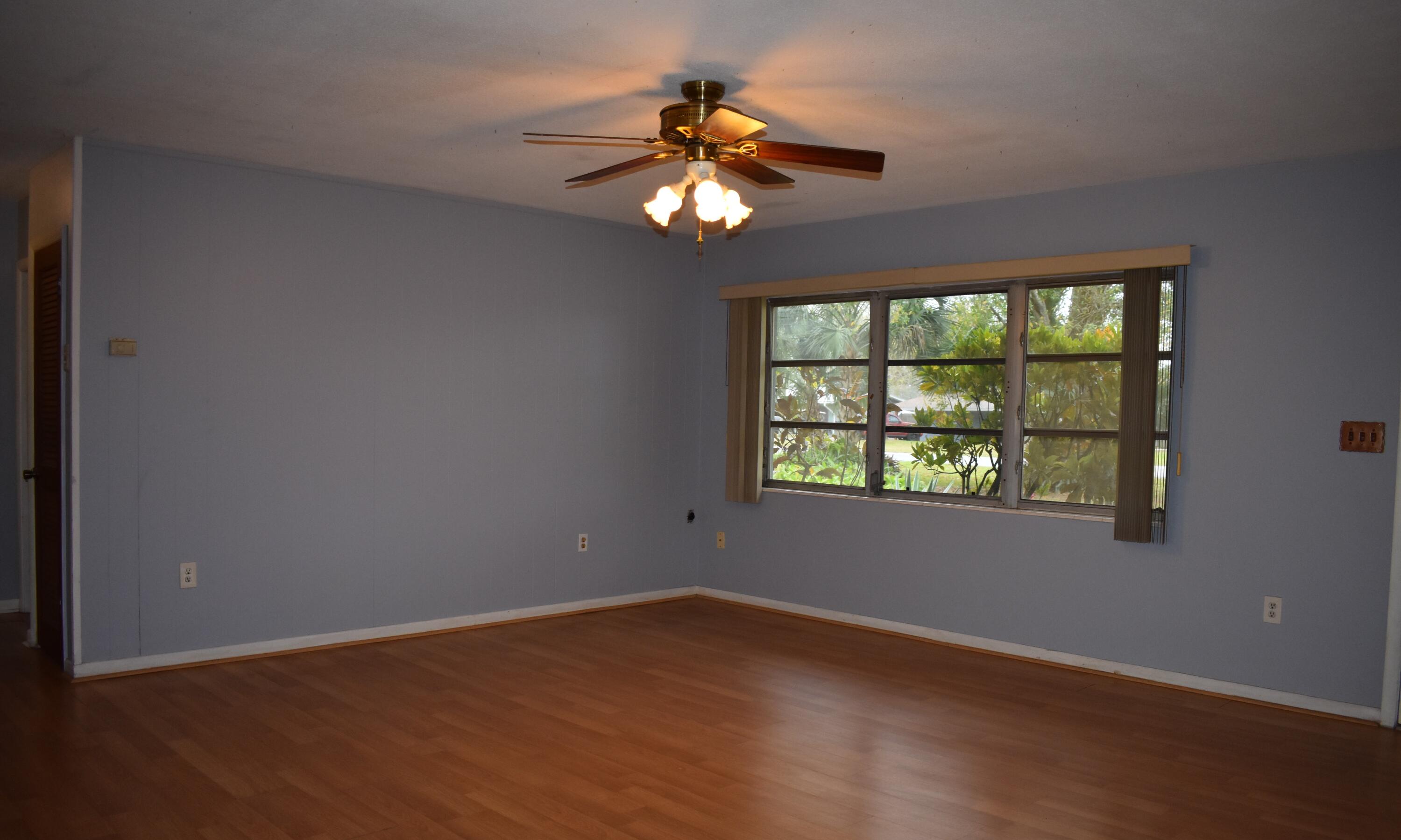 1812 Pinewood Road Melbourne, FL 32934 - Photo 6 of 31 a view of an empty room with a window