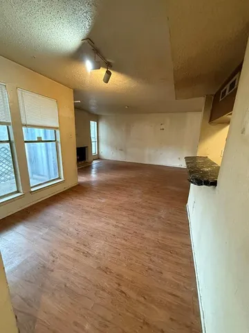 a kitchen with a stove and a refrigerator