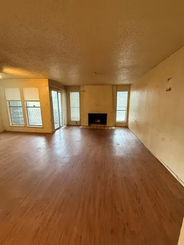 a kitchen with a stove a refrigerator and cabinets