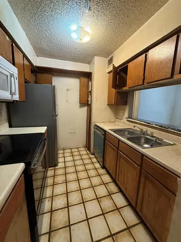 a living room with hard wood flooring