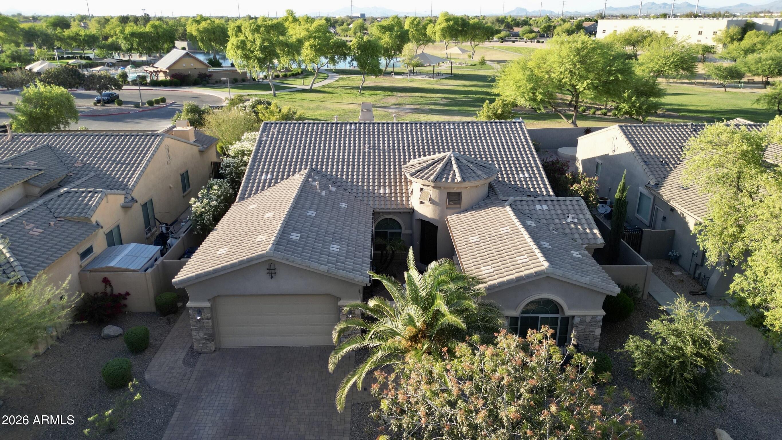 an aerial view of a house with a ocean view