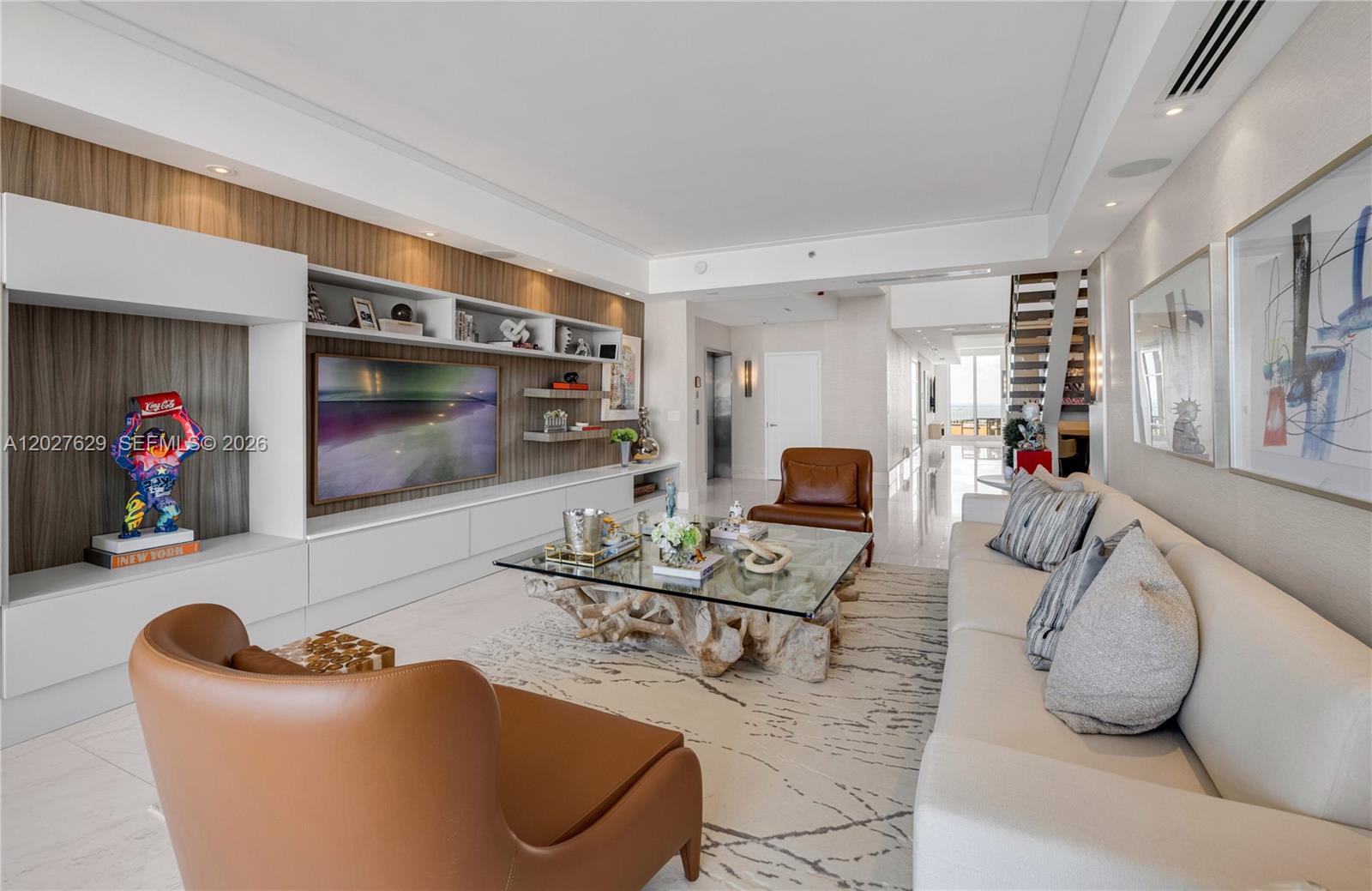 799 Crandon Boulevard, Unit PH8 Key Biscayne, FL 33149 - Photo 4 of 47 a living room with furniture and a flat screen tv
