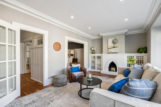 a living room with furniture and a fireplace