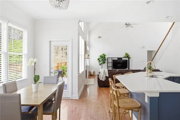 a view of a dining room with furniture window and wooden floor
