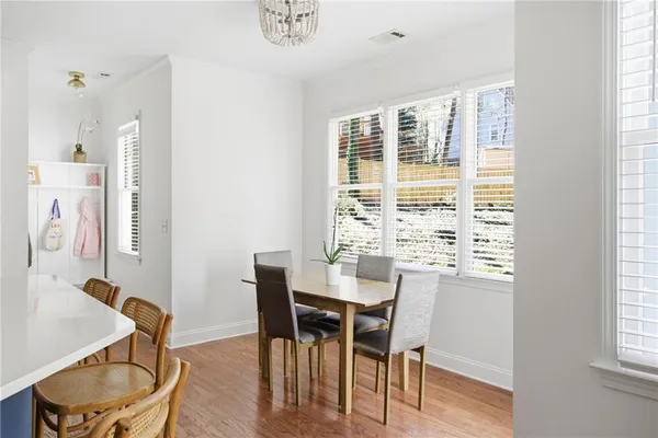 a view of a dining room with furniture and window