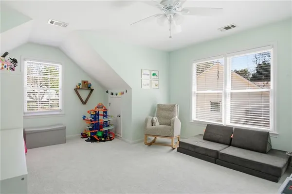 a bedroom with furniture and a window