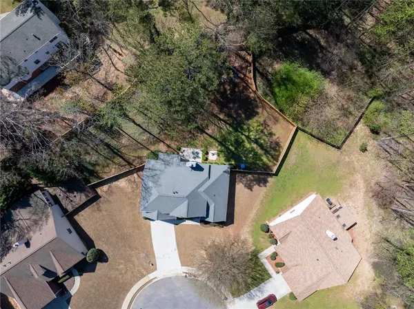 an aerial view of a house with outdoor space