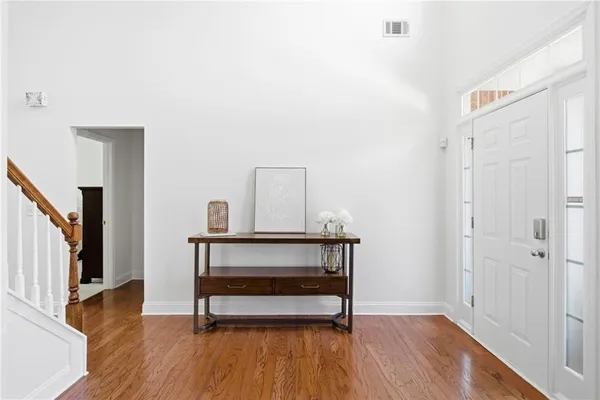 a view of bedroom with furniture and wooden floor