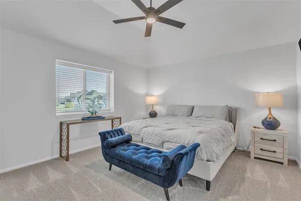 a bedroom with a bed and a table