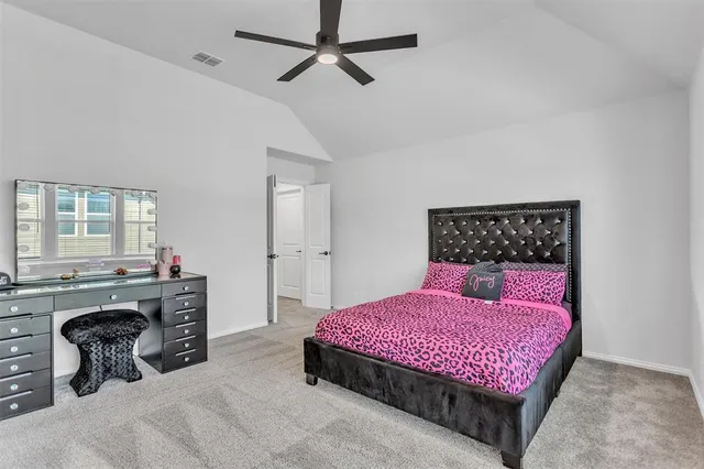 a bedroom with a bed and dresser