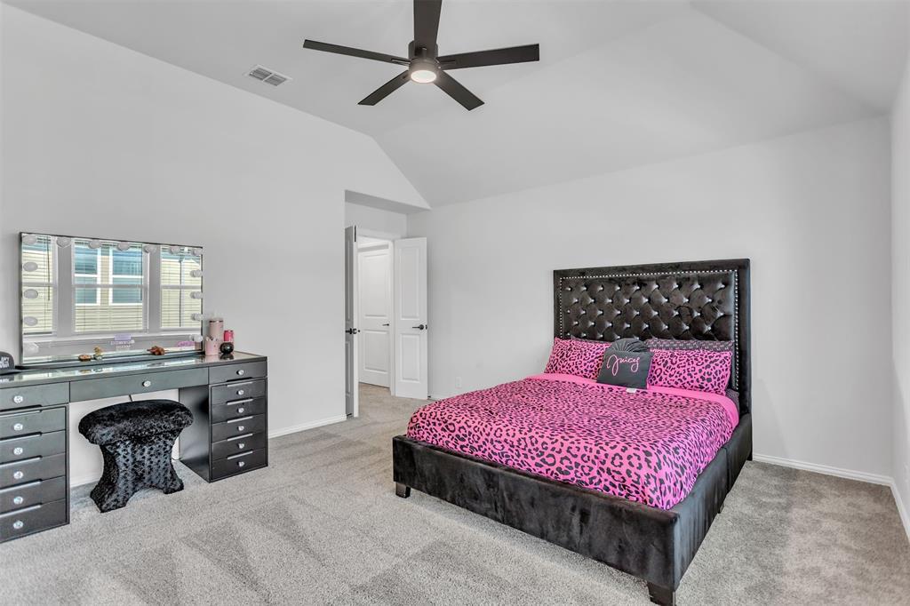 2311 Albion Way Forney, TX 75126 - Photo 23 of 30 a bedroom with a bed and dresser