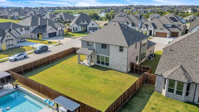 a view of multiple houses with a swimming pool
