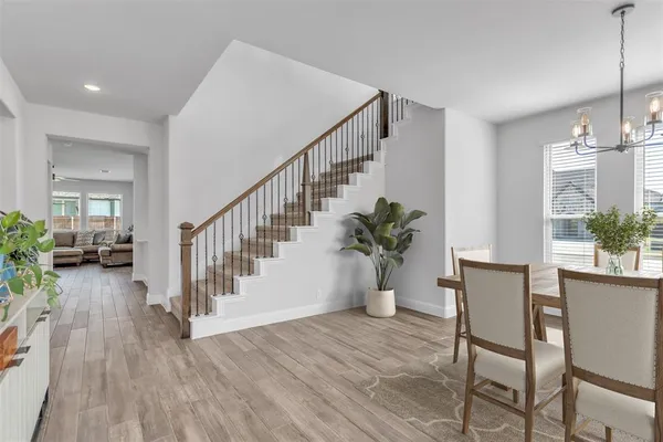 a view of an entryway and wooden floor