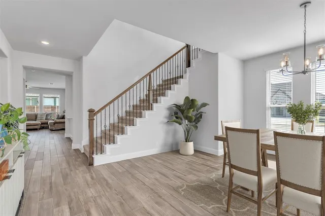 a view of an entryway and wooden floor