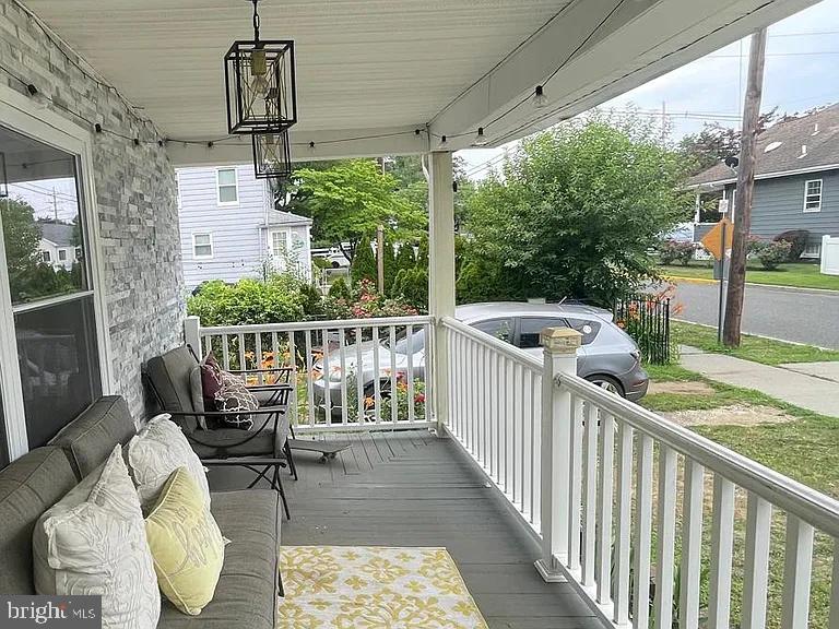 106 Reed Street Hightstown, NJ 08520 - Photo 2 of 14 Charming porch with lush greenery.
