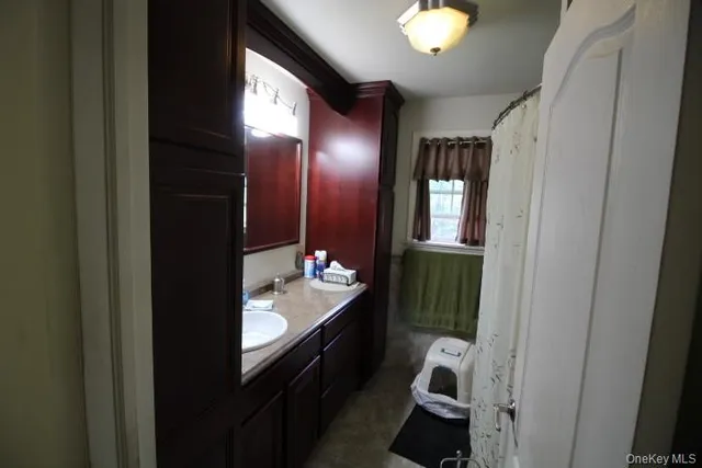 a bathroom with a sink and a mirror