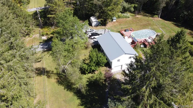 an aerial view of residential houses with outdoor space