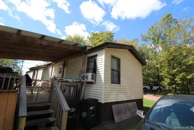 a view of backyard with wheel chair and potted plants