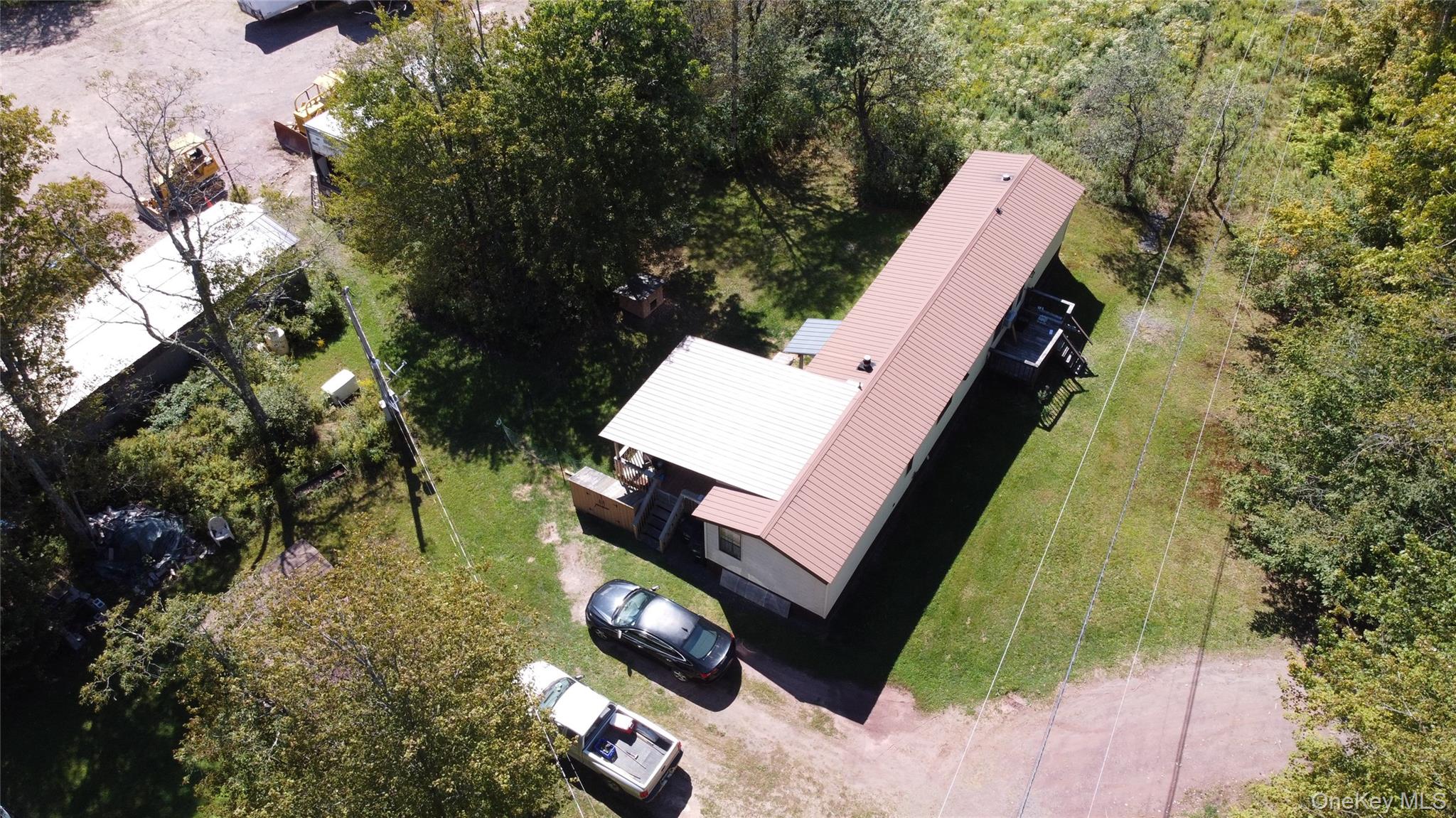 226 Goff Road, Unit 24 Livingston Manor, NY 12758 - Photo 6 of 49 a view of a yard with plants and wooden fence