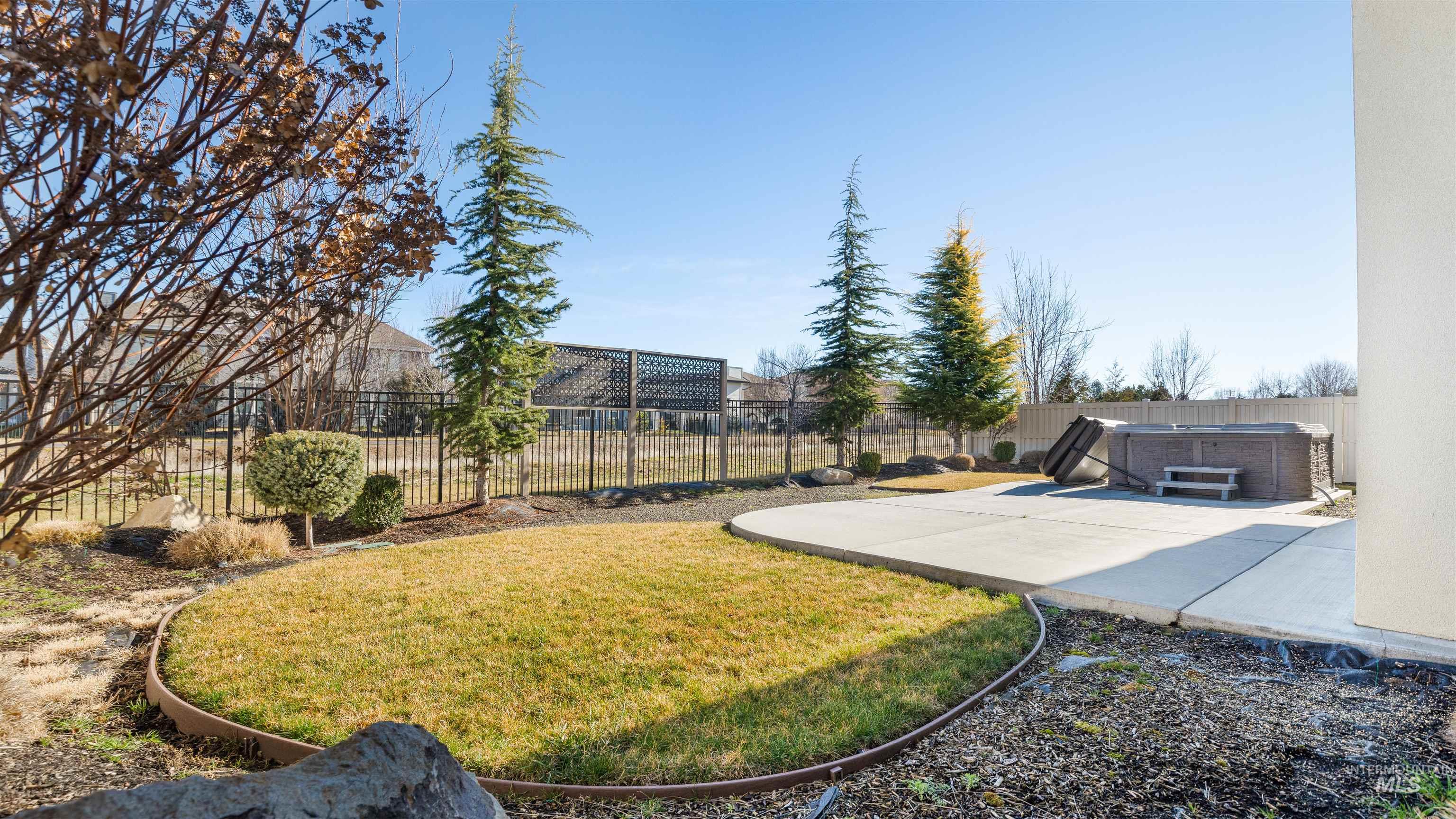 4676 South Abbot Meridian, ID 83642 - Photo 12 of 49 Fenced backyard featuring a patio area and a hot tub