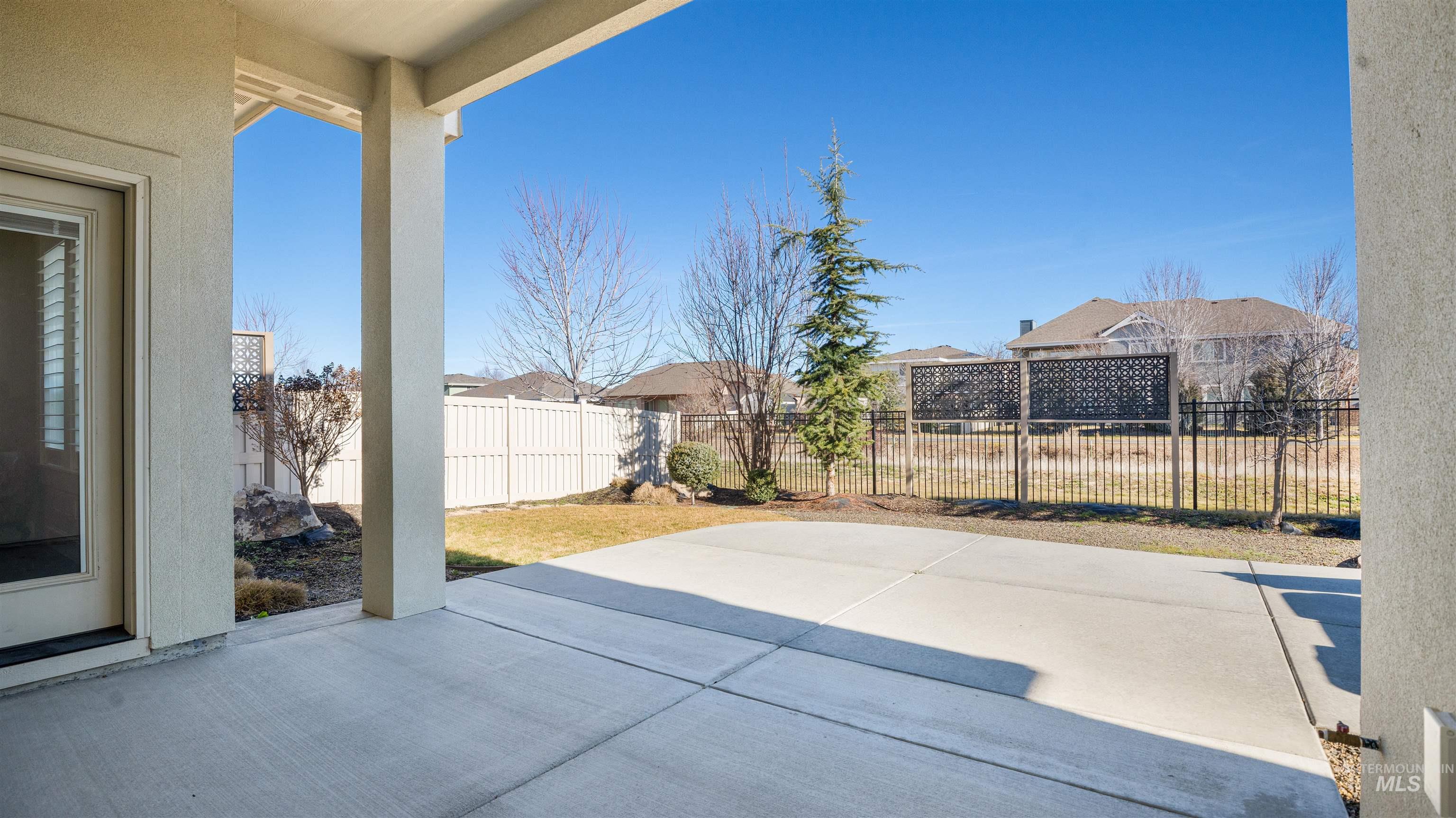4676 South Abbot Meridian, ID 83642 - Photo 15 of 49 Fenced backyard featuring a patio area and a residential view
