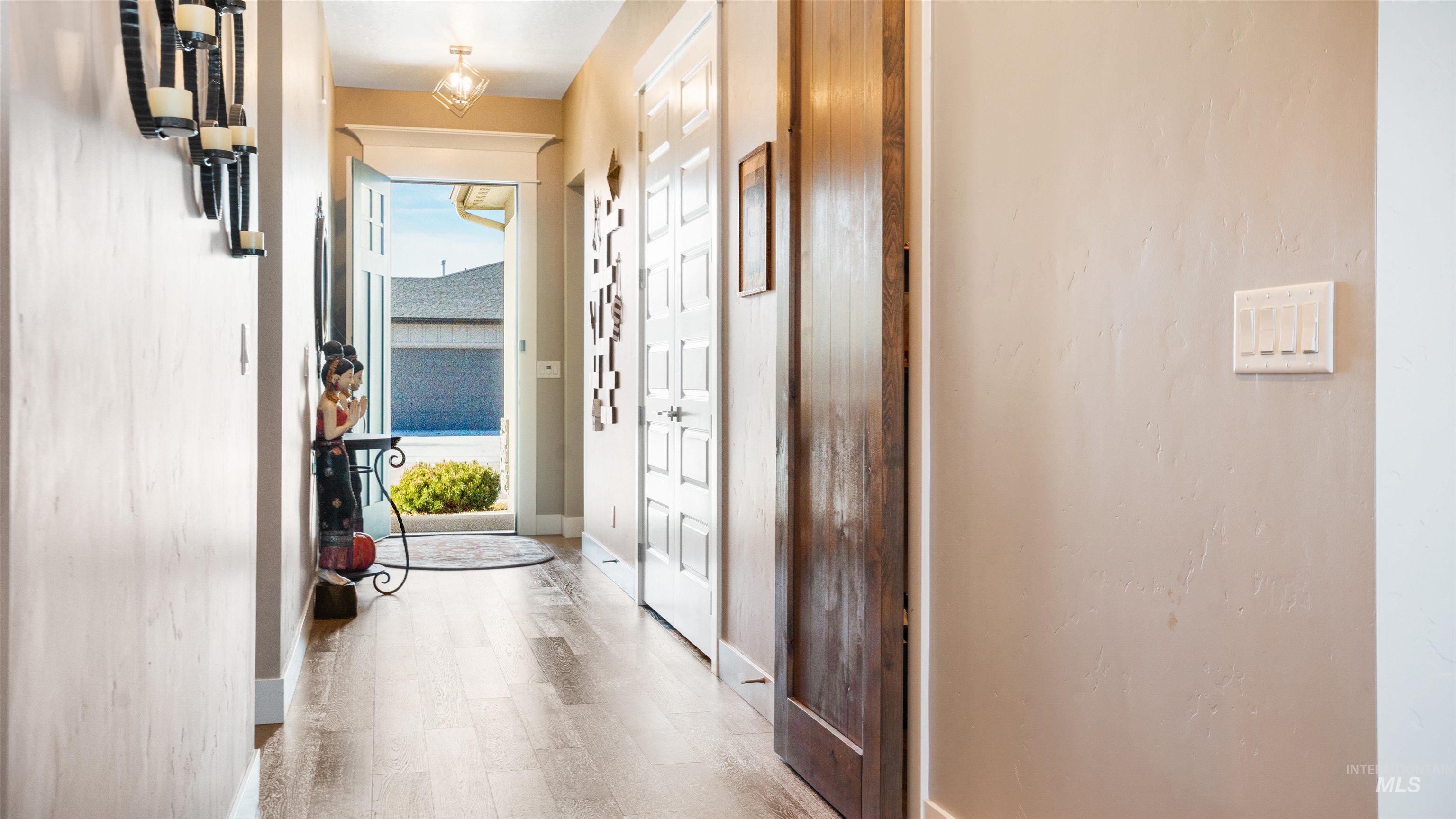 4676 South Abbot Meridian, ID 83642 - Photo 16 of 49 Corridor with baseboards and light wood finished floors